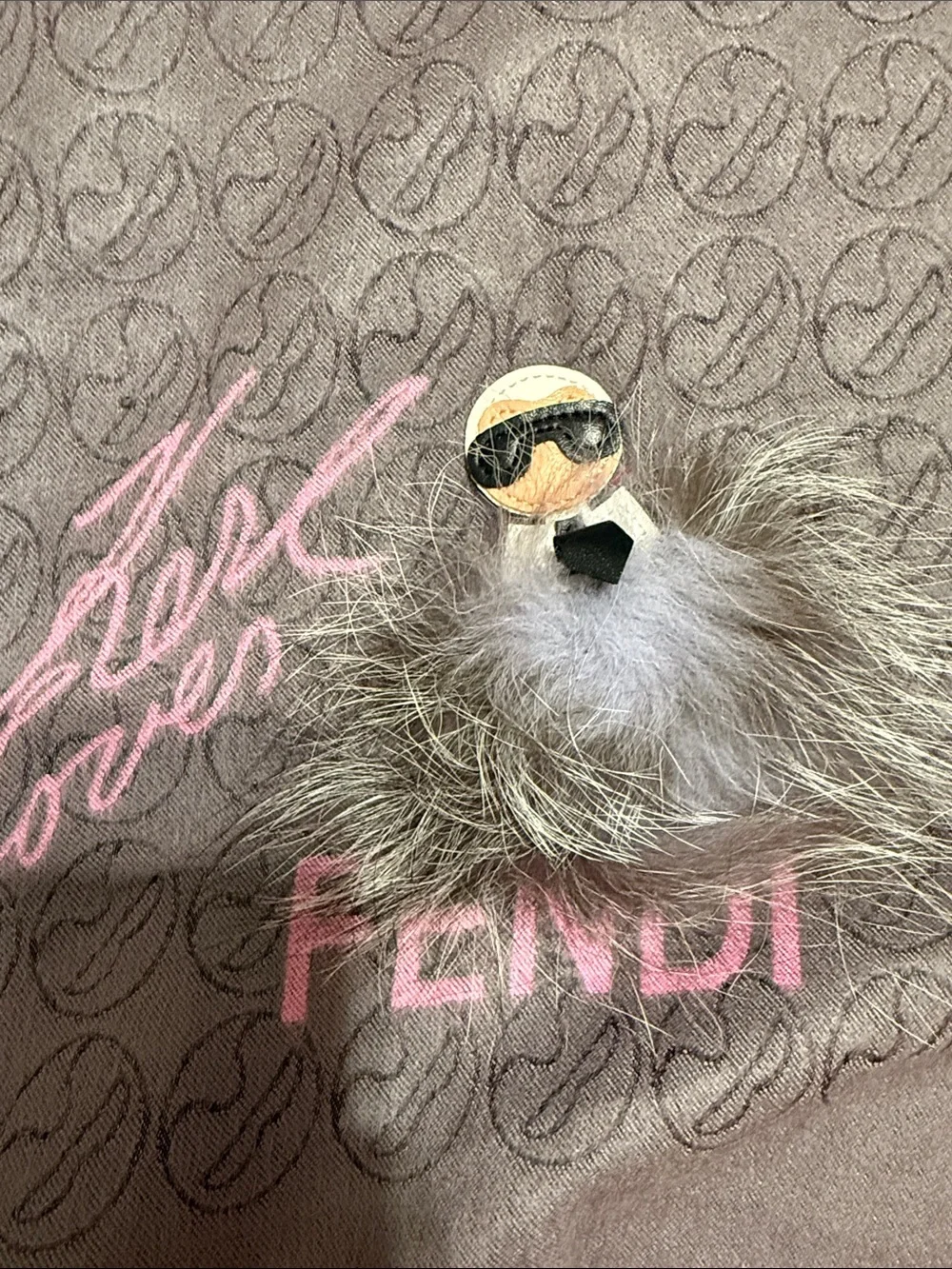 Karl Lagerfeld taupe and pink logo jacquard scarf with fur charm